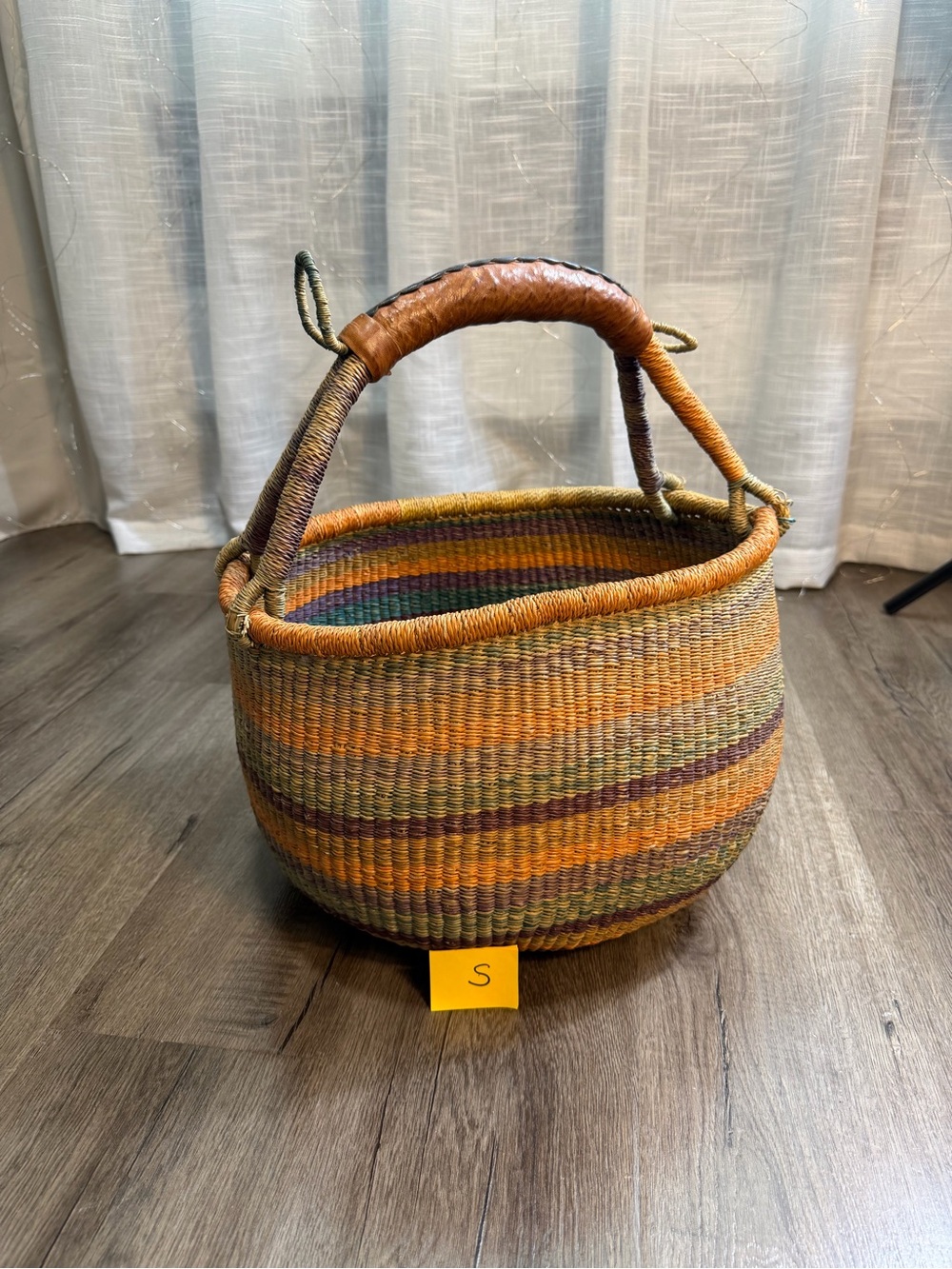 Large handmade vintage shopping basket with a leather handle.